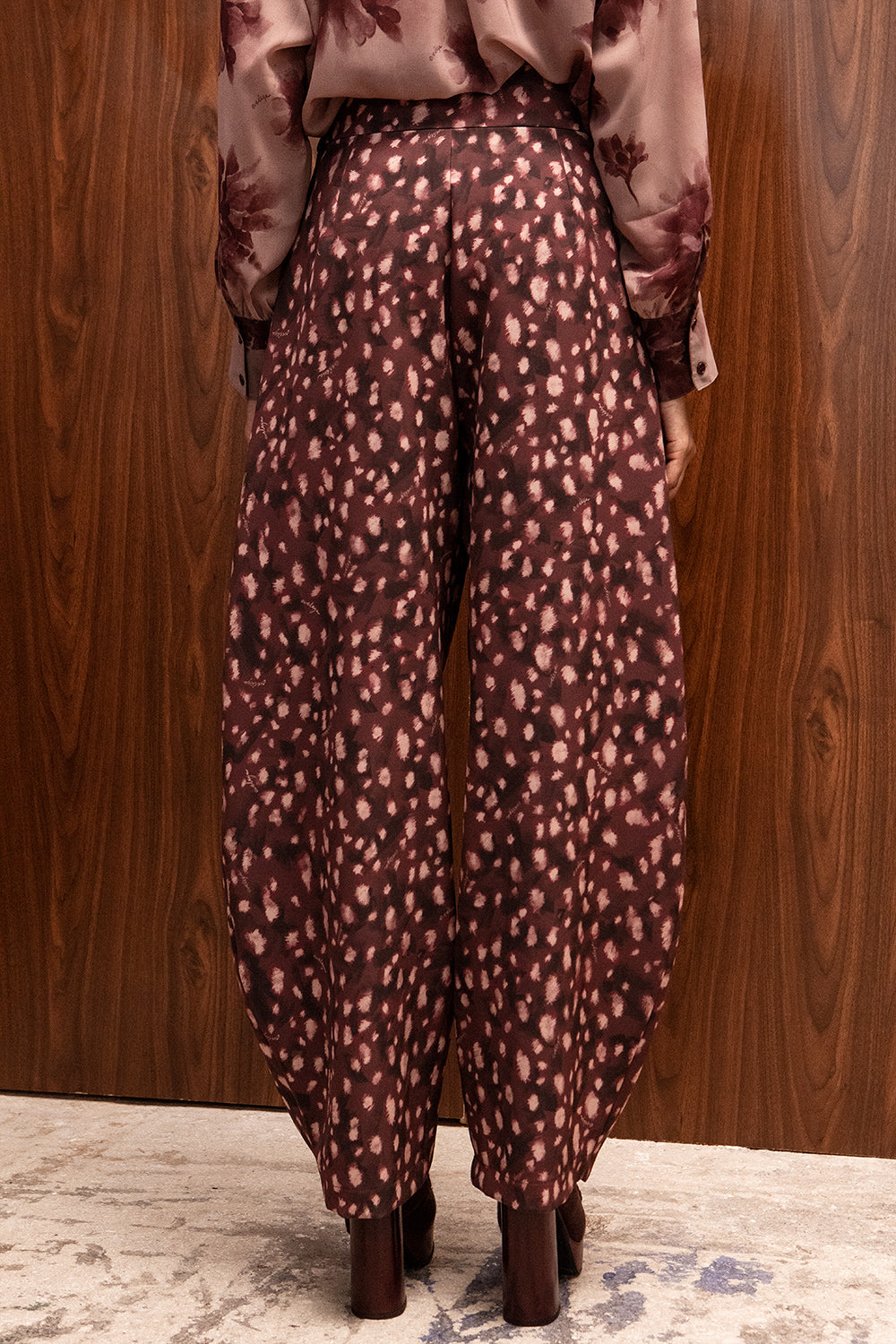 BURGUNDY BAMBI PRINT BARREL LEG PANTS